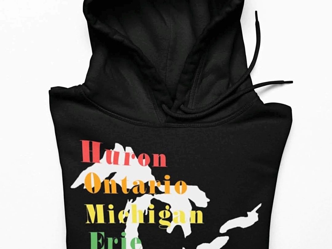 Black hoodie printed with a Great Lakes design in white lettering