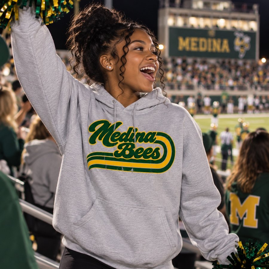 Medina Bees retro script printed in green and gold on a heather gray hoodie