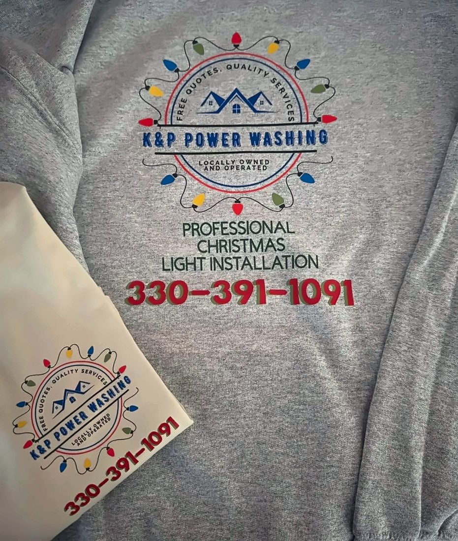 Grey and cream crewnecks printed with the K&P Power Washing logo and phone number